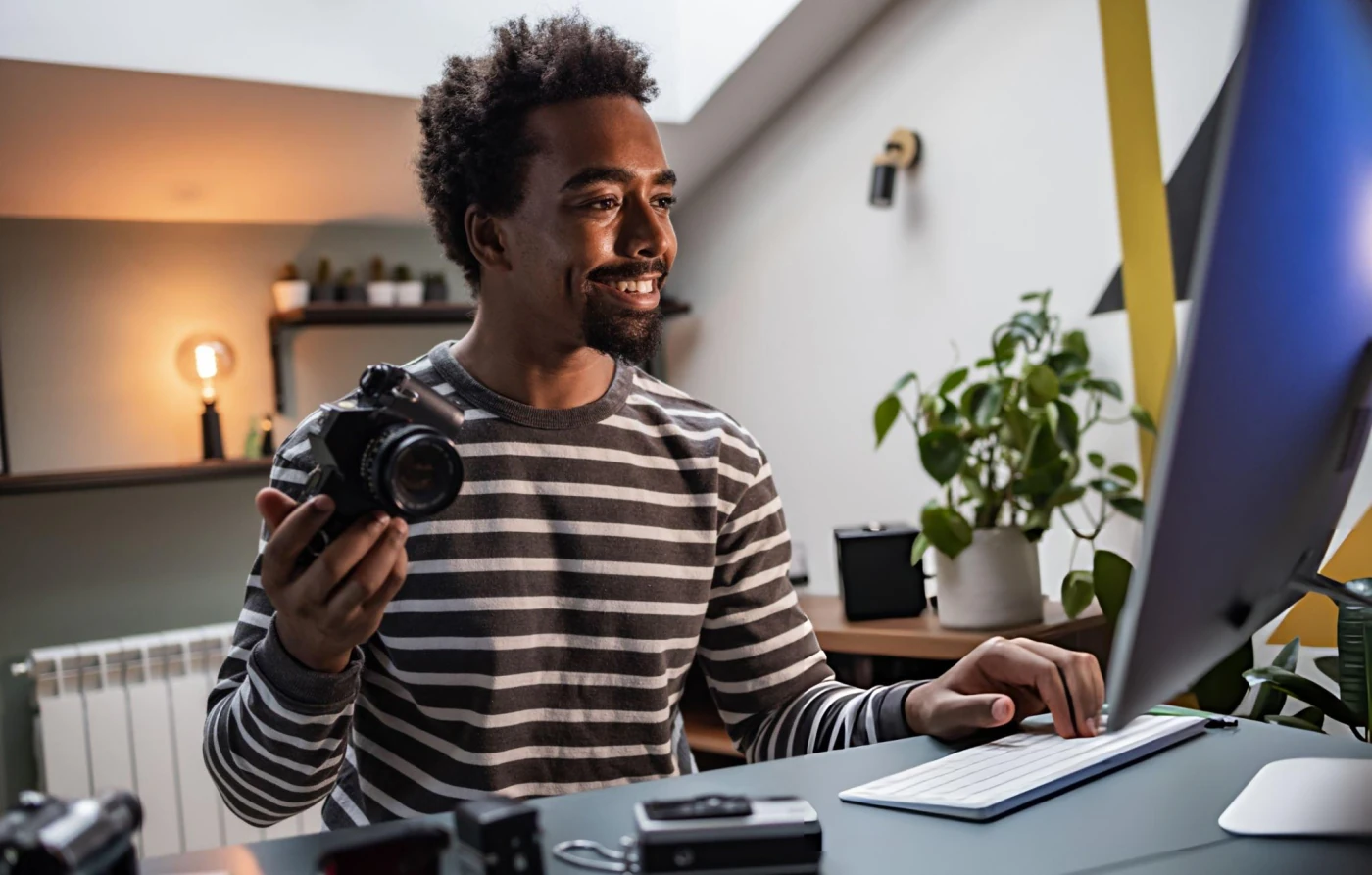 Affiliate creator with camera at desk